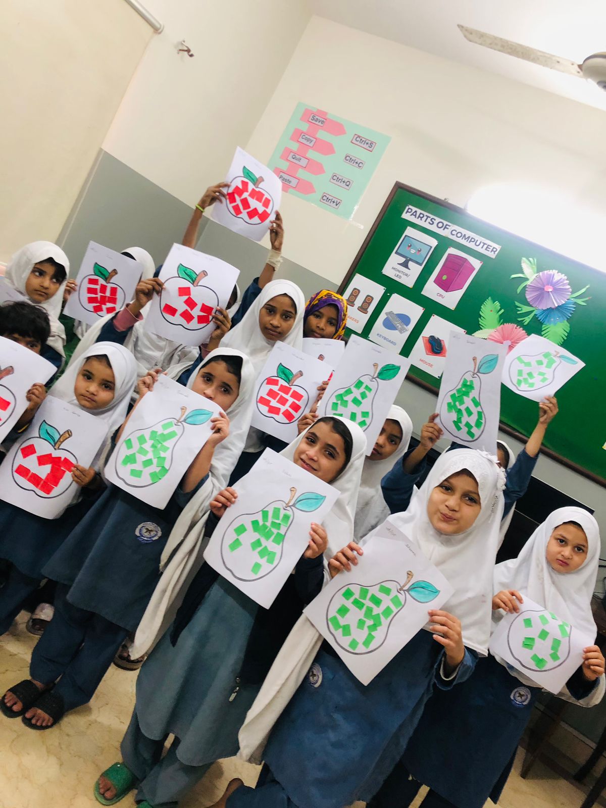 Students learning with a parts-of-computer display